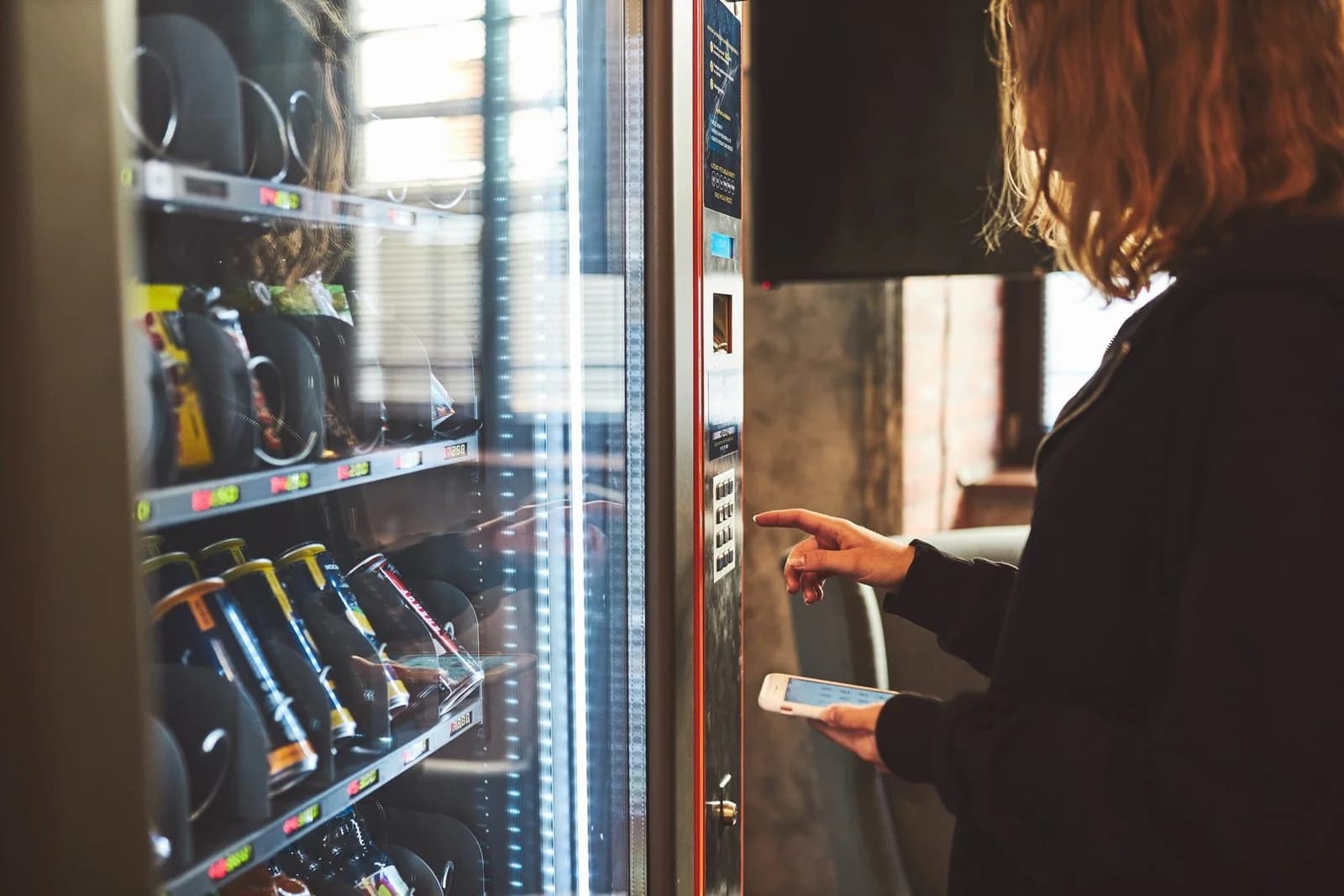A customer paying at a vending machine